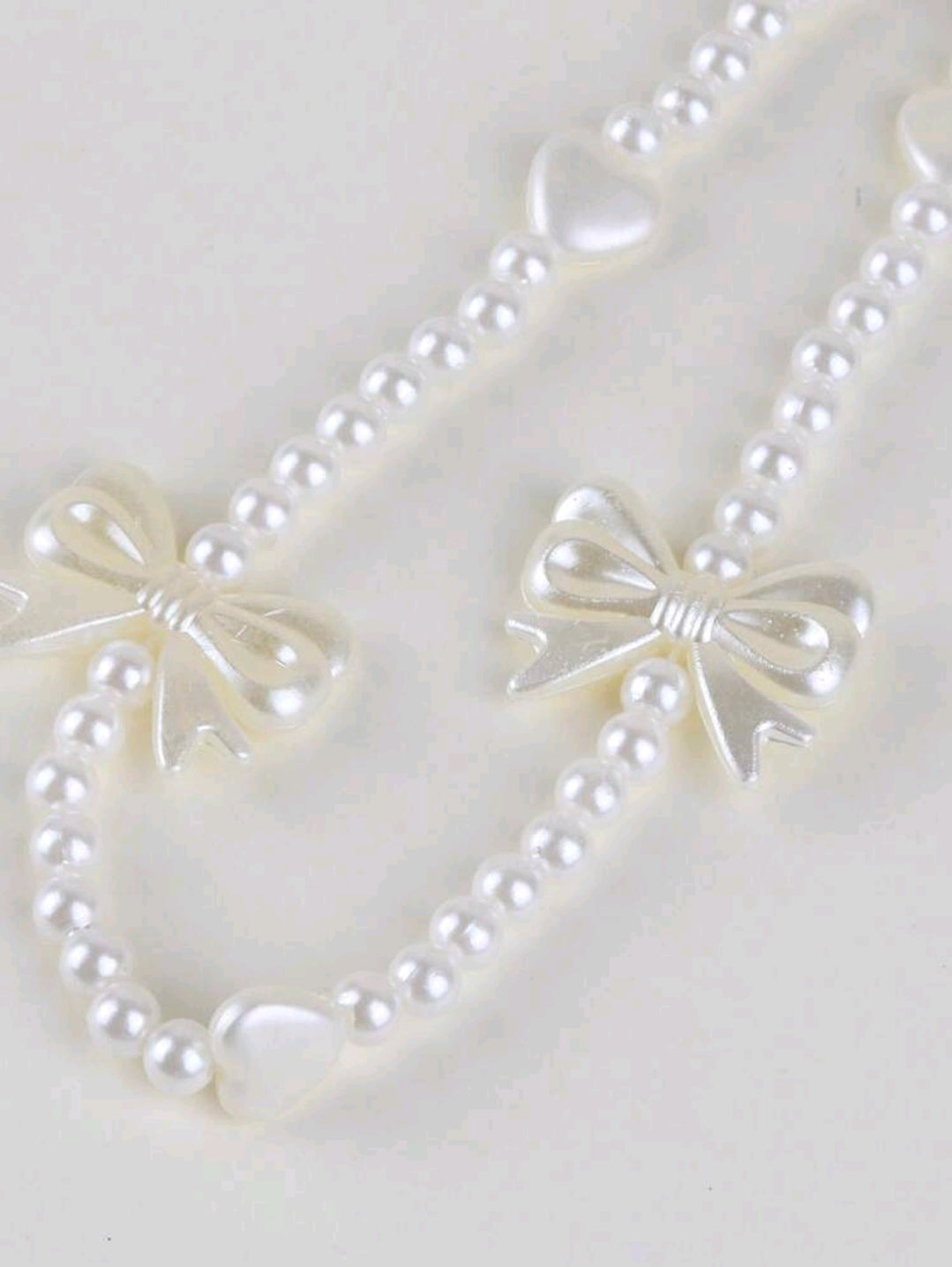 White bow phone charm
