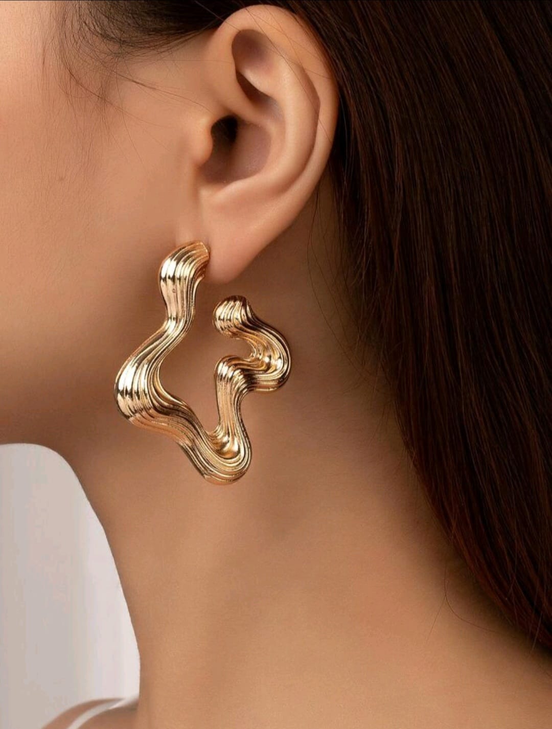 Irregular shaped golden earrings