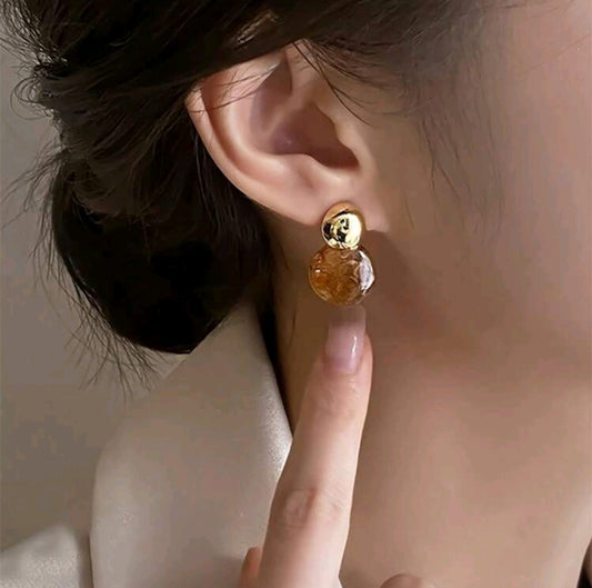 Brown and golden earrings