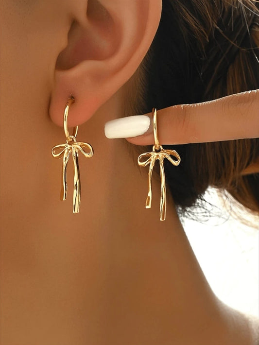 Bow detail golden earrings