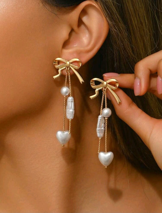 White and golden bow earrings