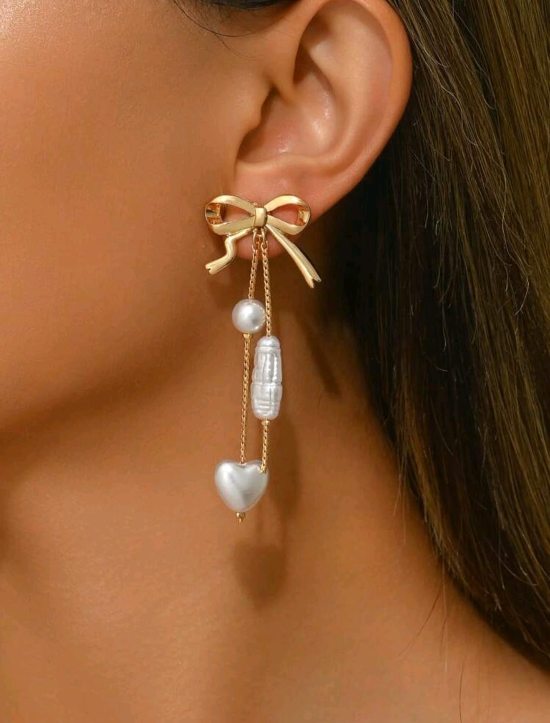 White and golden bow earrings