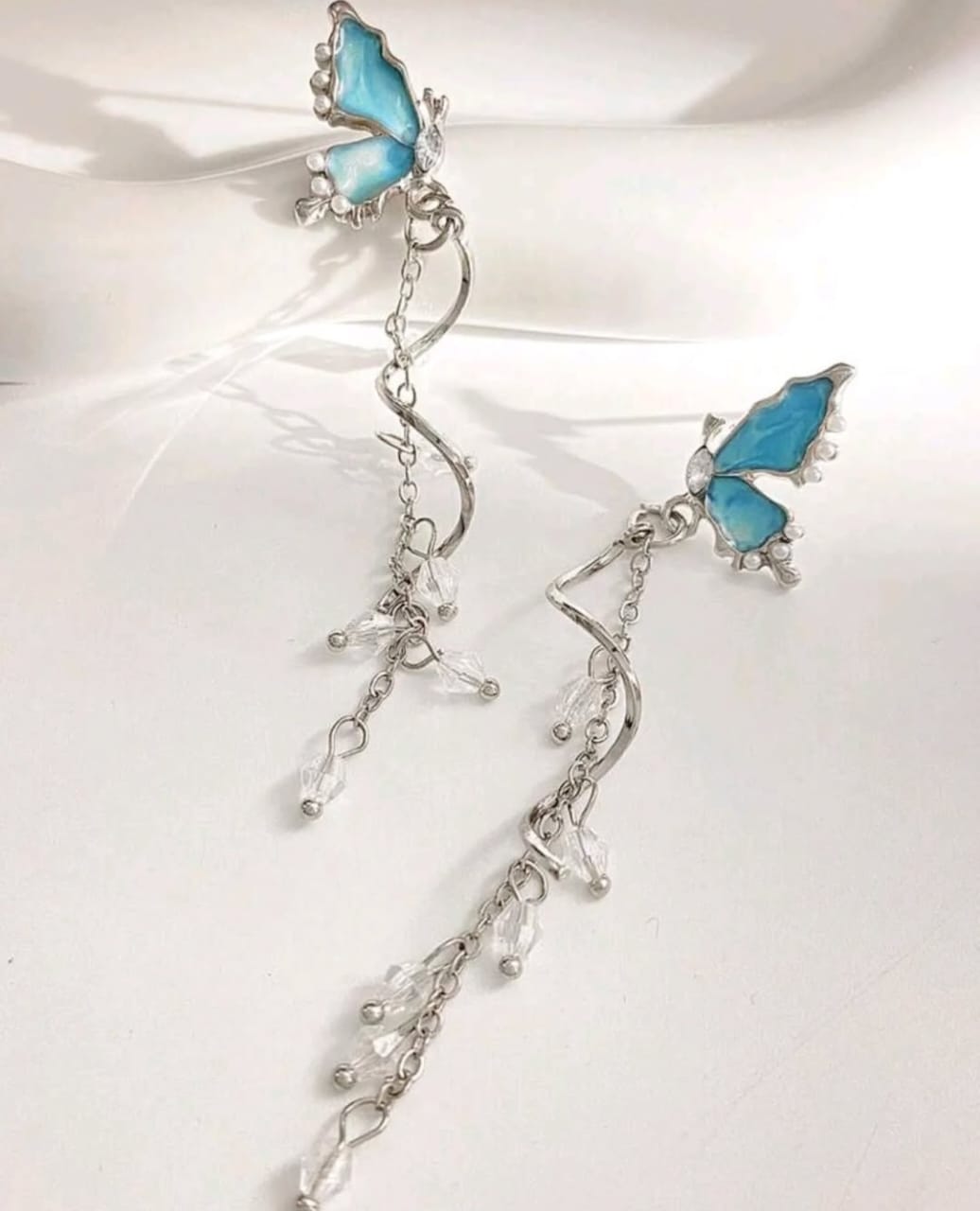 Blue butterfly dangle earrings