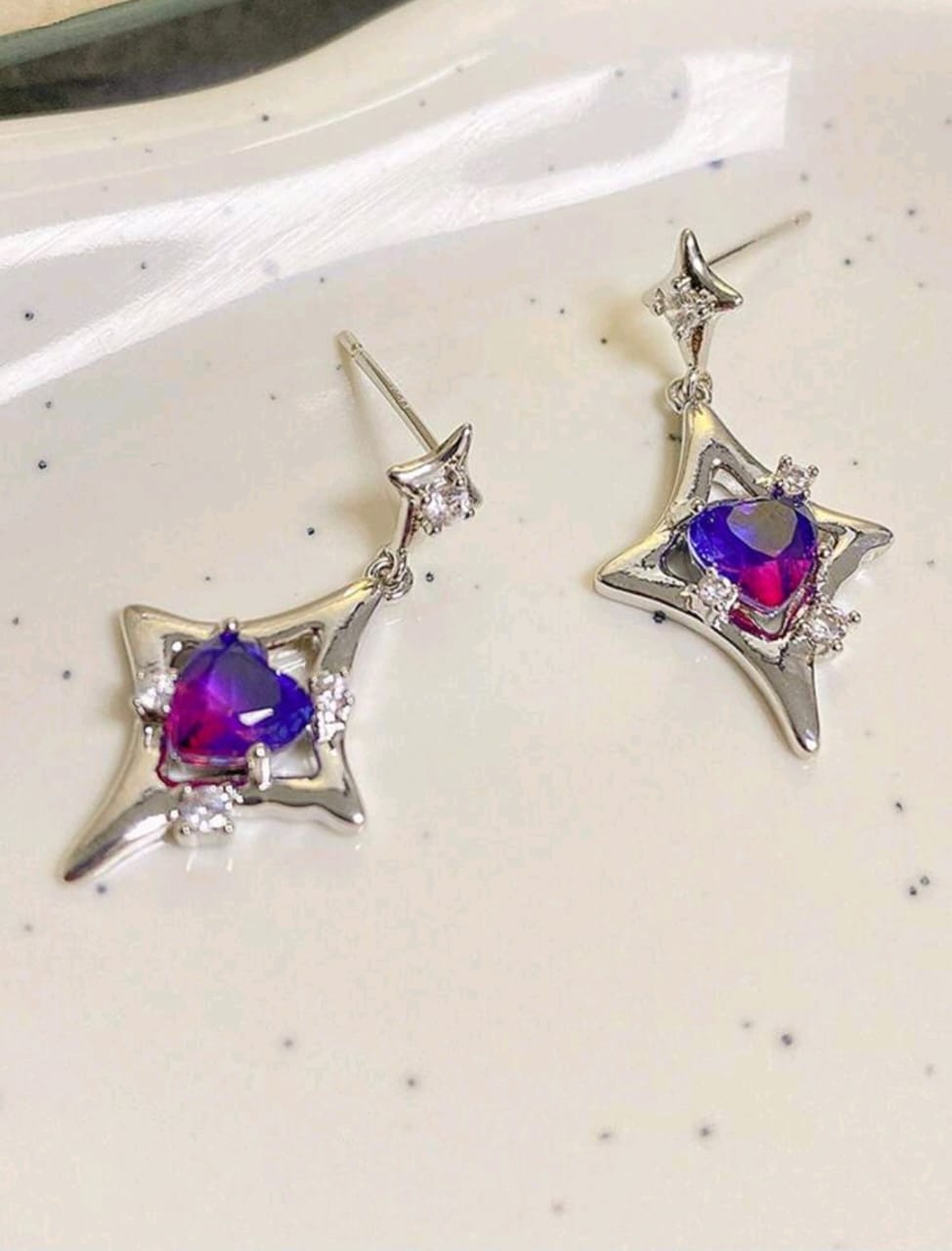Silver earrings with purple stone