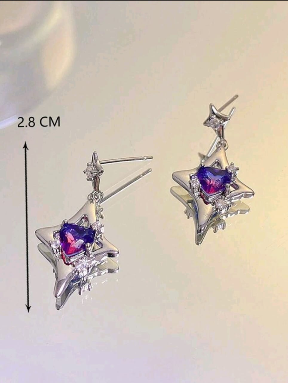 Silver earrings with purple stone