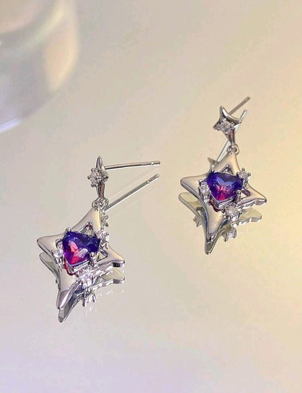 Silver earrings with purple stone