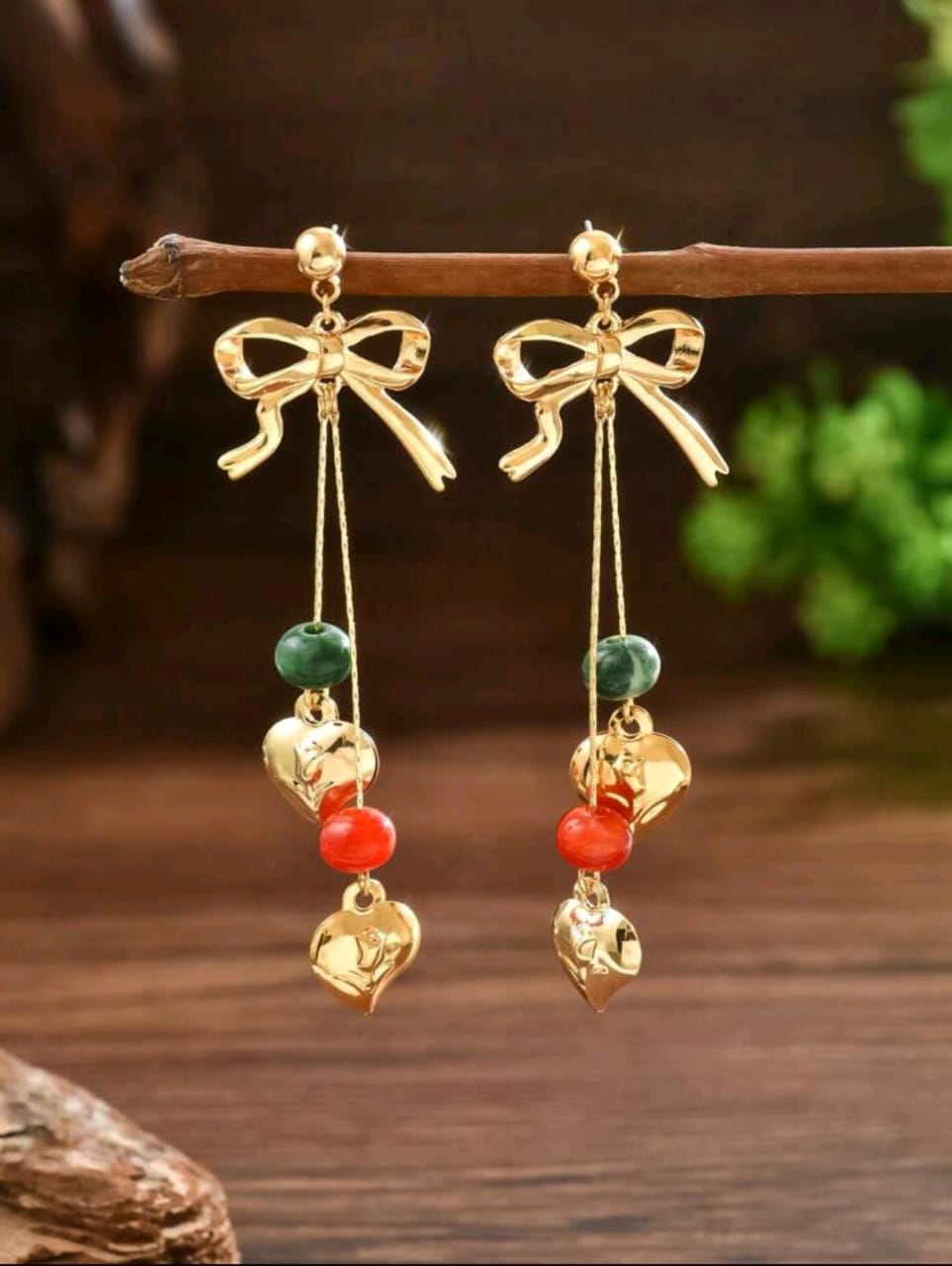 Bow detail earrings with charms