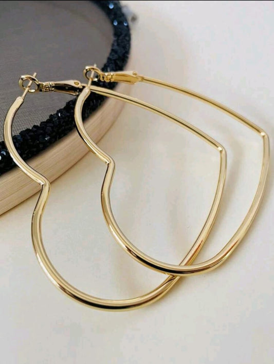 Heart shaped golden hoop earrings