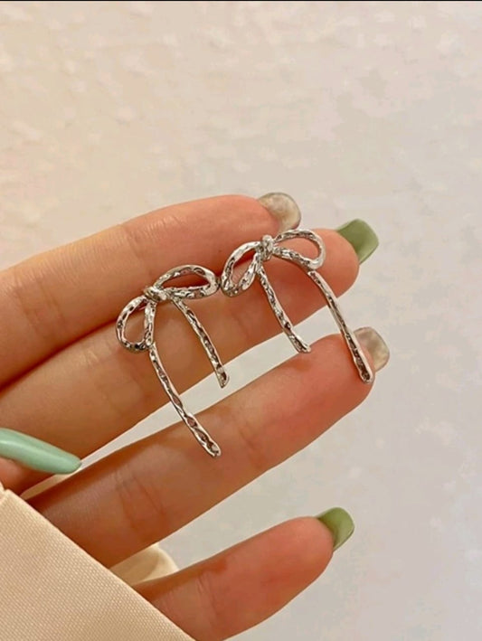 Bow silver stud earrings
