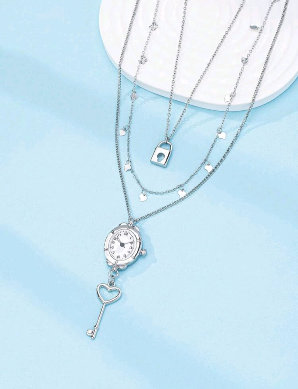 Triple layered silver clock necklace