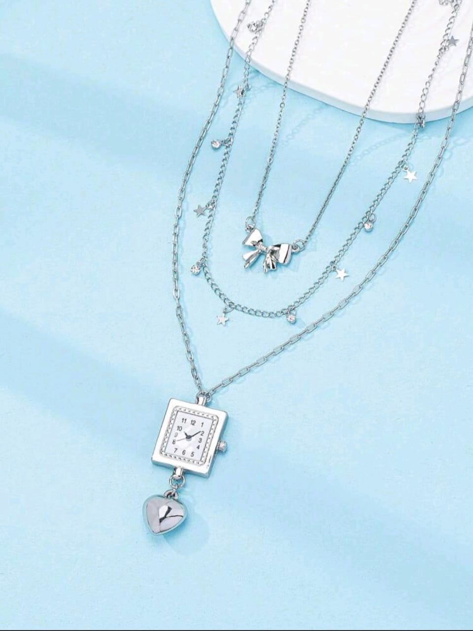 Triple layered silver clock necklace