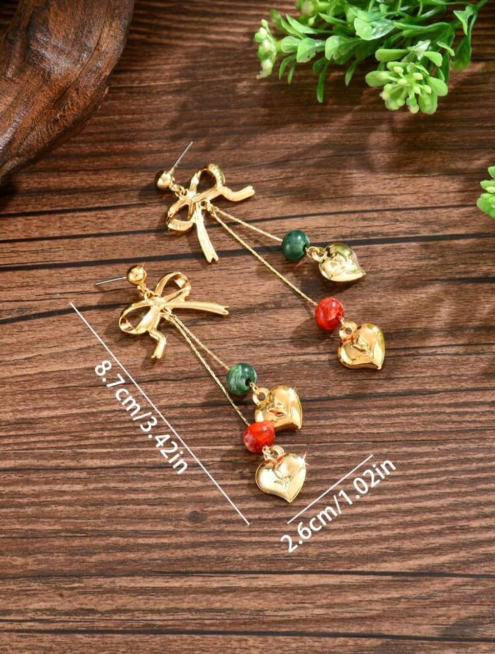 Bow detail earrings with charms