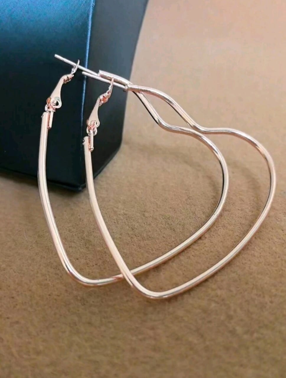 Heart shaped golden hoop earrings