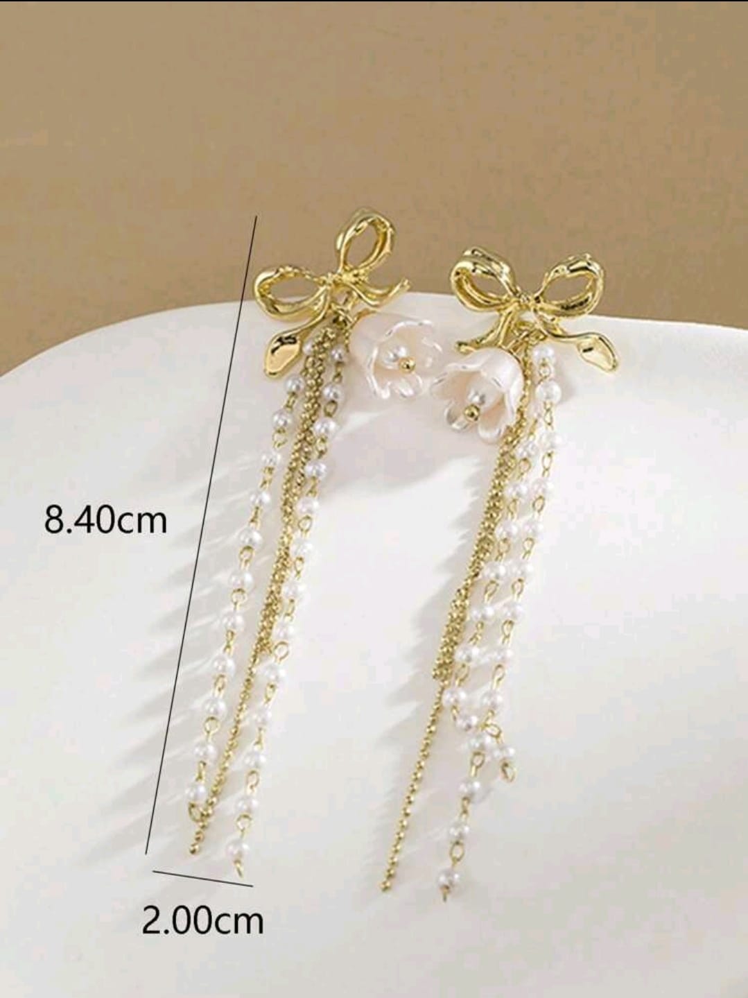 Bow detail pearl earrings