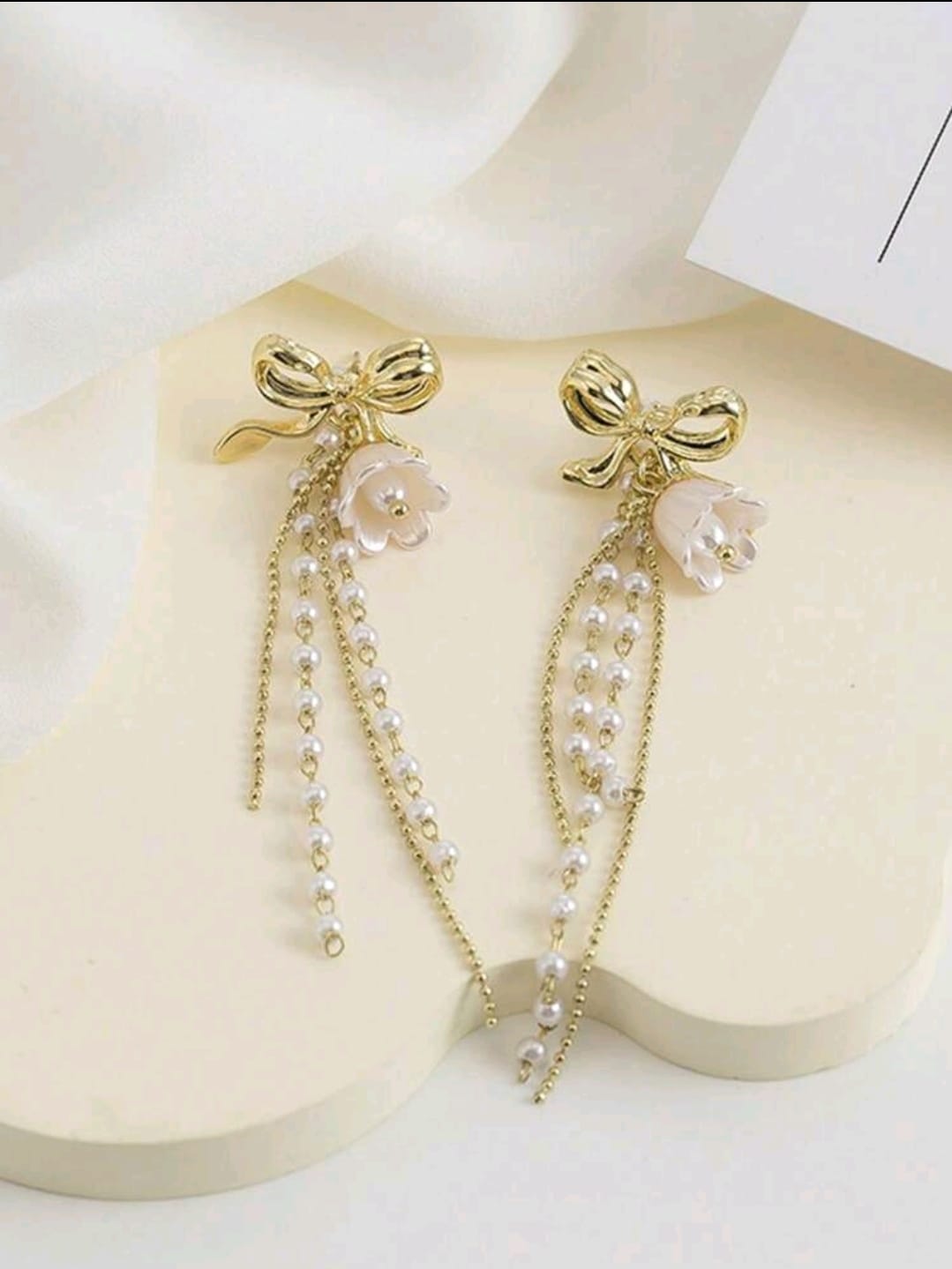 Bow detail pearl earrings