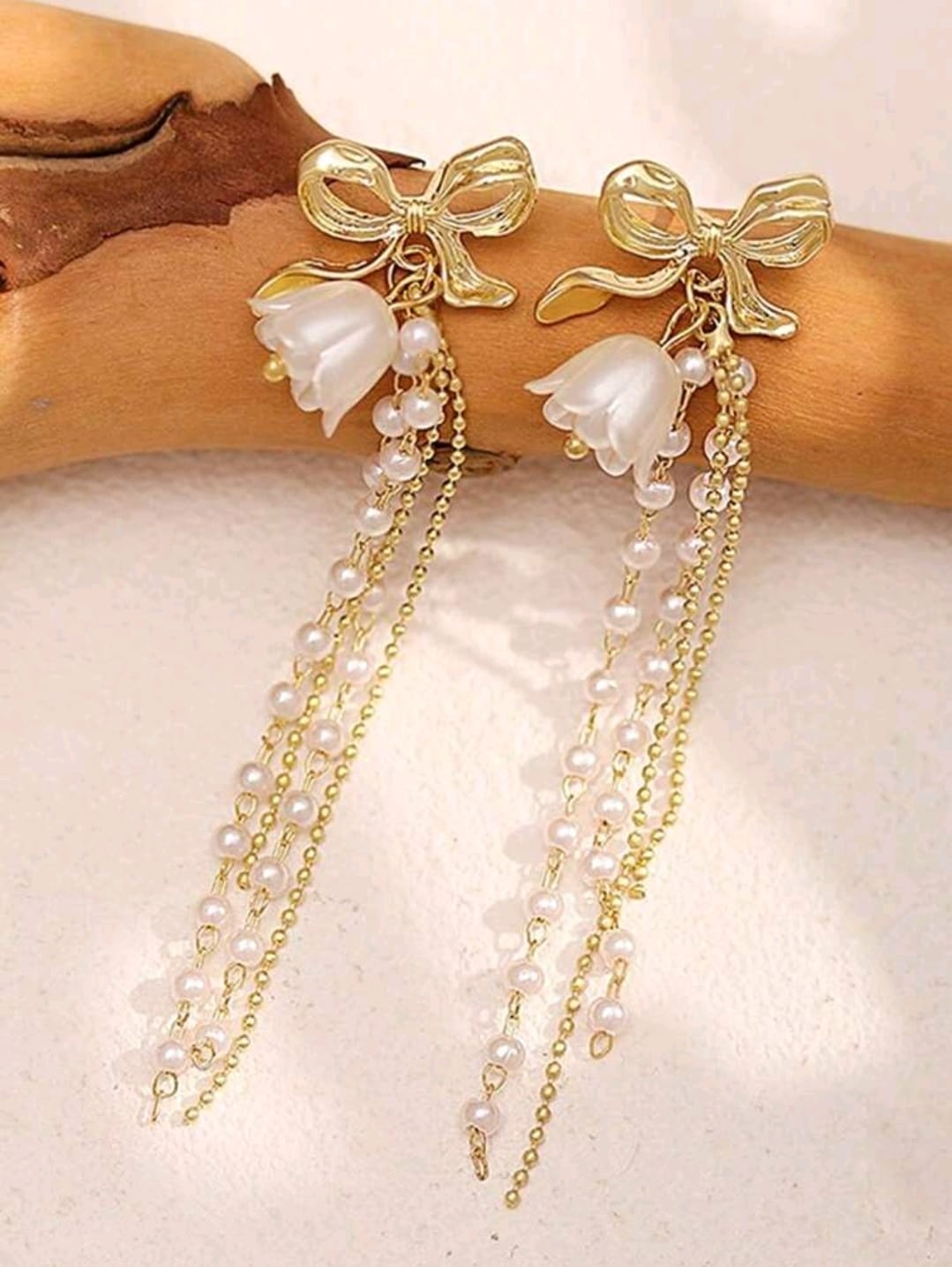Bow detail pearl earrings